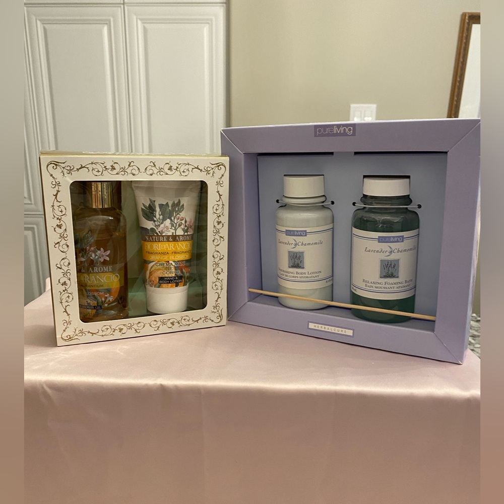 TWO NEW IN BOX SETS OF BODY LOTIONS AND BATH AND SHOWER GELS